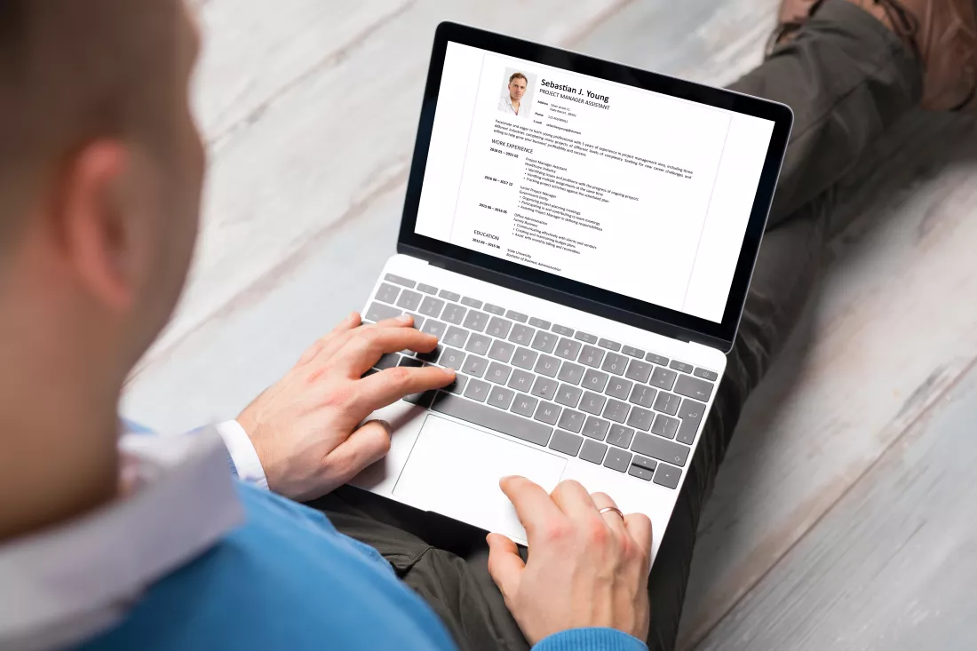 man-creating-his-cv-laptop-all-contents-document-are-made-up